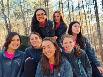 Anna Padron and six other Scranton missioners smile for a goofy picture with Scrantons beautiful landscape in the background. 