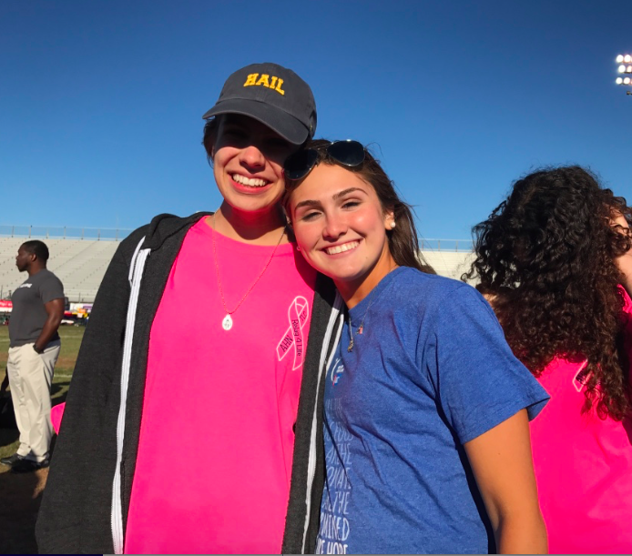 Team+Captain+Gabby+Delp+and+Senior+Lindsey+Calka+join+up+for+a+picture+while+they+wait+for+the+opening+ceremony.+