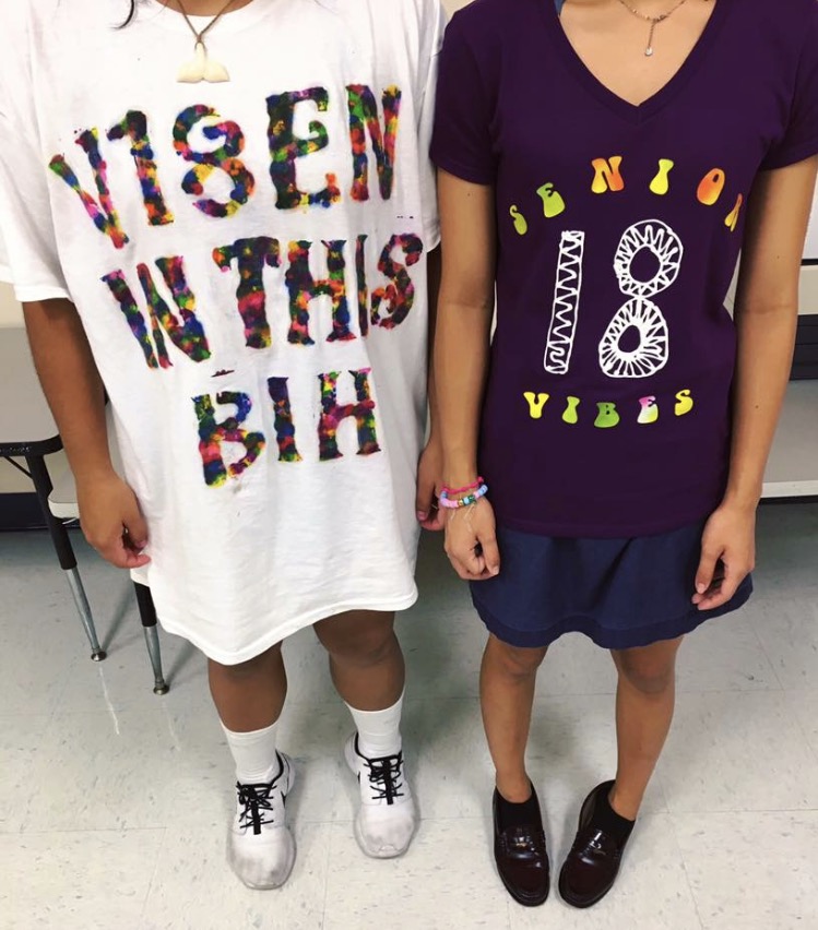 Seniors+Vanessa+Davila+and+Gillian+Garcia+take+on+a+vibey+twist+for+their+senior+shirts.+